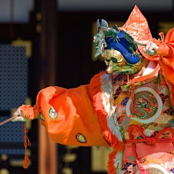 Colorful traditional Japanese costume with intricate mask in Kyoto.